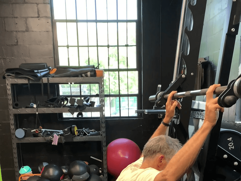 mobility work on the training floor at Empire MMA