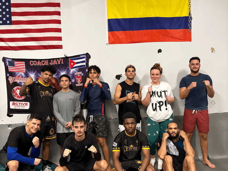 fight class training on the mats at Empire MMA
